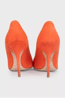 Orange suede pumps