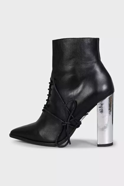 Black leather ankle boots with a pointed toe