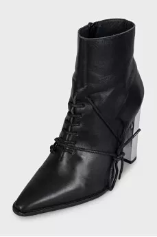 Black leather ankle boots with a pointed toe