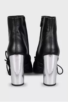 Black leather ankle boots with a pointed toe