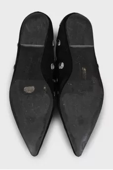 Black suede ballet flats with pointed toe and metallic embellishments