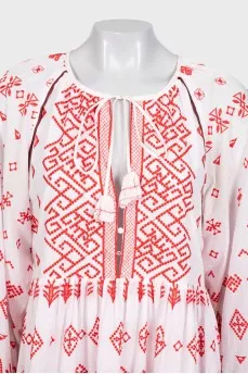 White mini dress with red embroidery and long sleeves