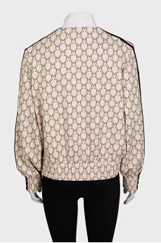 Windbreaker with a zip in a signature print