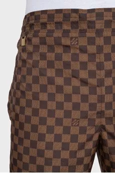 Men's brown shorts with a signature print
