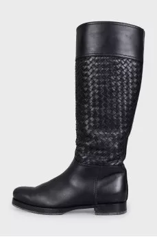 Black leather boots decorated with braiding