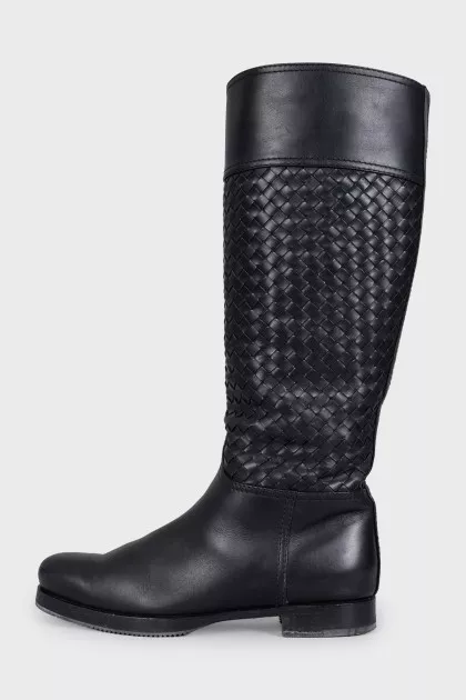 Black leather boots decorated with braiding