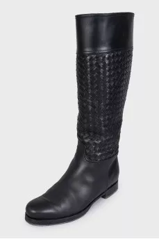 Black leather boots decorated with braiding