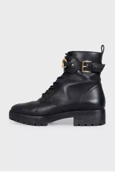 Black leather boots with gold-tone hardware