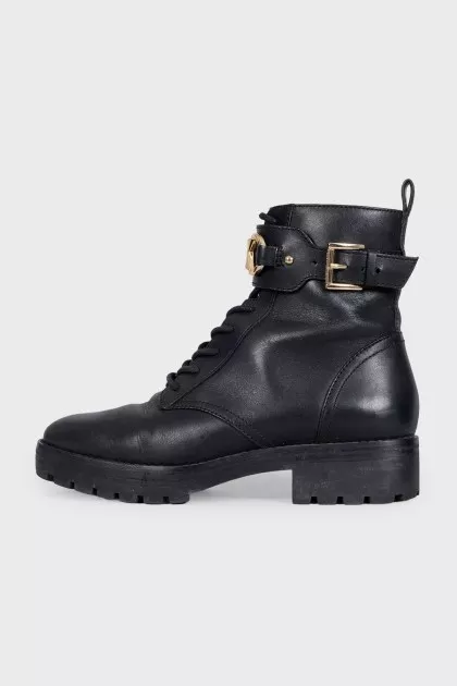 Black leather boots with gold-tone hardware