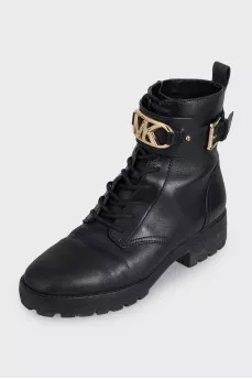 Black leather boots with gold-tone hardware