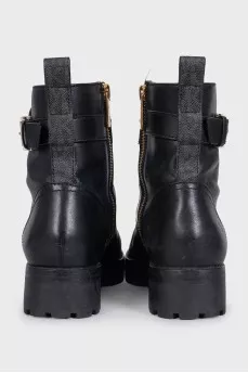 Black leather boots with gold-tone hardware