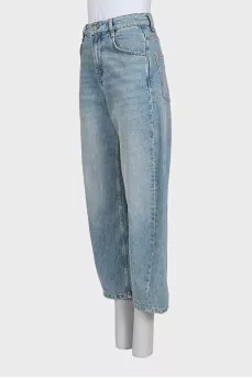 Tapered distressed jeans with tag