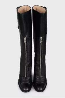 High leather boots with stiletto heels and a zipper
