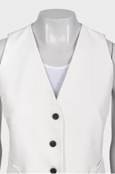 White suit with a skirt, jacket and vest