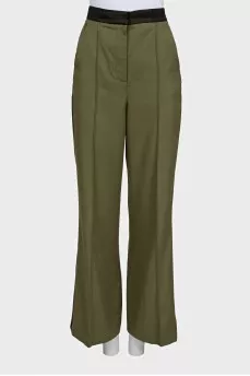 Suit of trousers with stripes and asymmetrical jacket