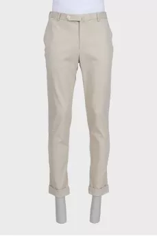 Men's beige trousers with a zipper and buttons