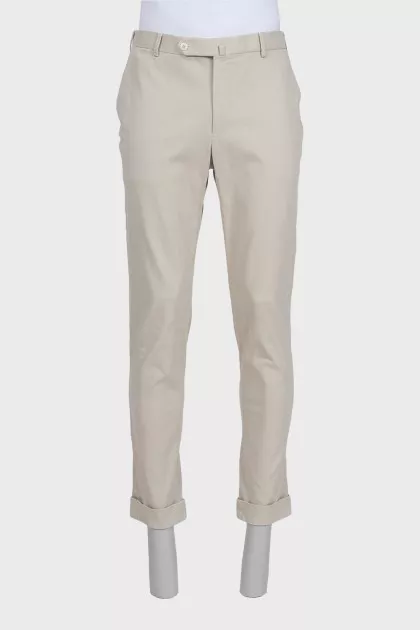 Men's beige trousers with a zipper and buttons