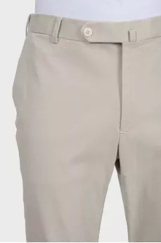 Men's beige trousers with a zipper and buttons