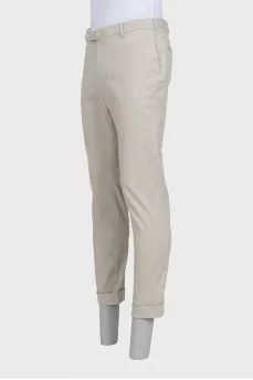 Men's beige trousers with a zipper and buttons