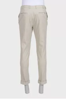 Men's beige trousers with a zipper and buttons