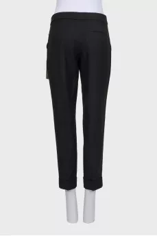 Black cuffed trousers with tag