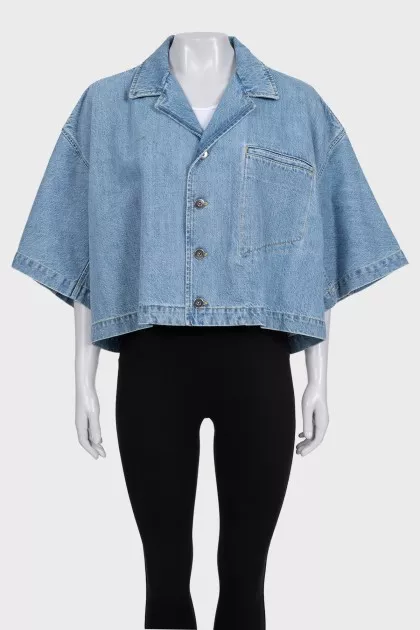 Blue denim jacket with tag