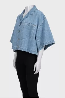 Blue denim jacket with tag