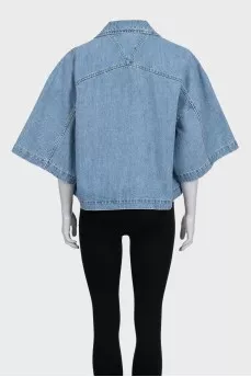 Blue denim jacket with tag