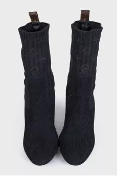 Fabric ankle boots with a figured heel and no fastening
