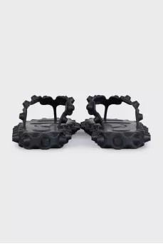 Black flip-flops with a chunky sole