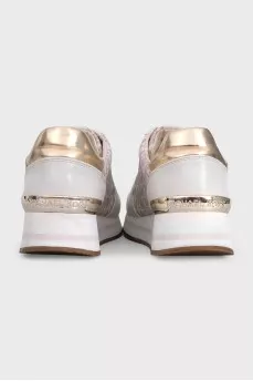 Beige sneakers with a signature print
