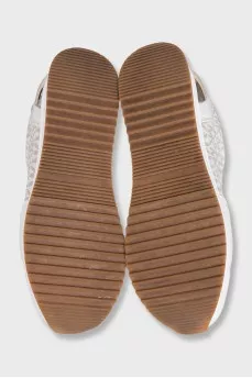 Beige sneakers with a signature print