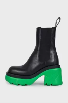 Black leather boots with bright soles