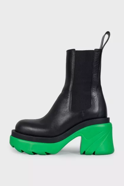 Black leather boots with bright soles