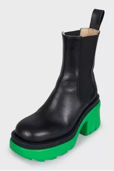 Black leather boots with bright soles
