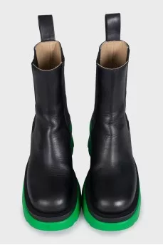 Black leather boots with bright soles