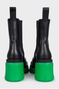Black leather boots with bright soles
