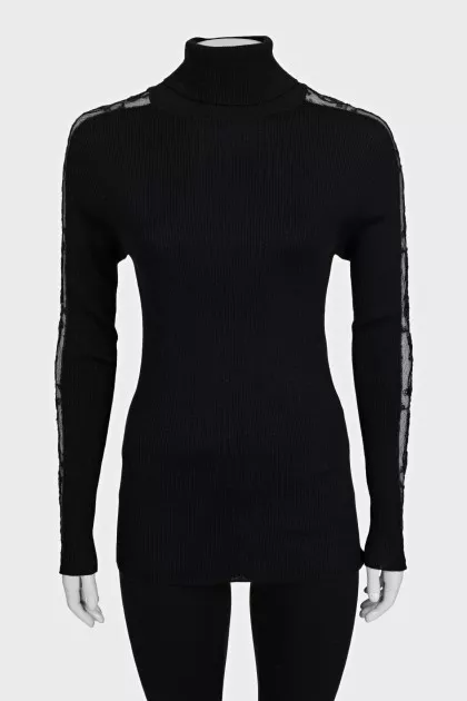 Black turtleneck with lace inserts on the sleeves
