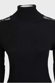 Black turtleneck with lace inserts on the sleeves