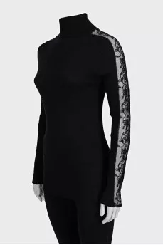 Black turtleneck with lace inserts on the sleeves