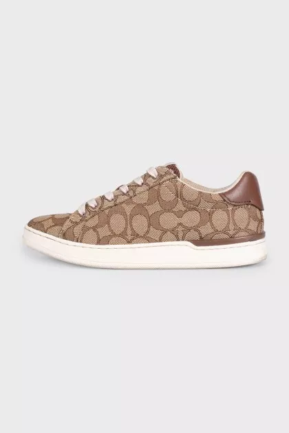 Brown textile sneakers with a signature print