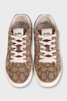 Brown textile sneakers with a signature print