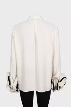 Beige blouse with ruffled sleeves
