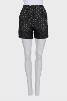 Perforated suit consisting of a jacket and shorts
