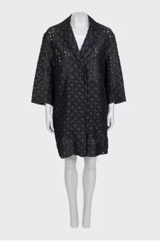Perforated suit consisting of a jacket and shorts