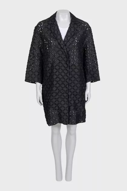Perforated suit consisting of a jacket and shorts