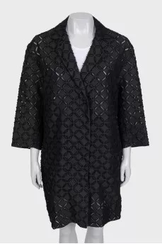 Perforated suit consisting of a jacket and shorts