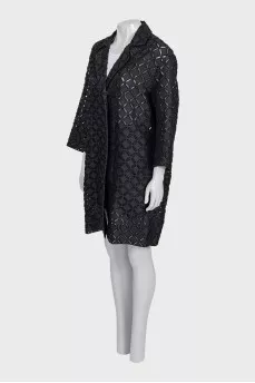 Perforated suit consisting of a jacket and shorts