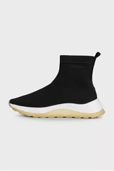 Black textile sneakers with a white sole