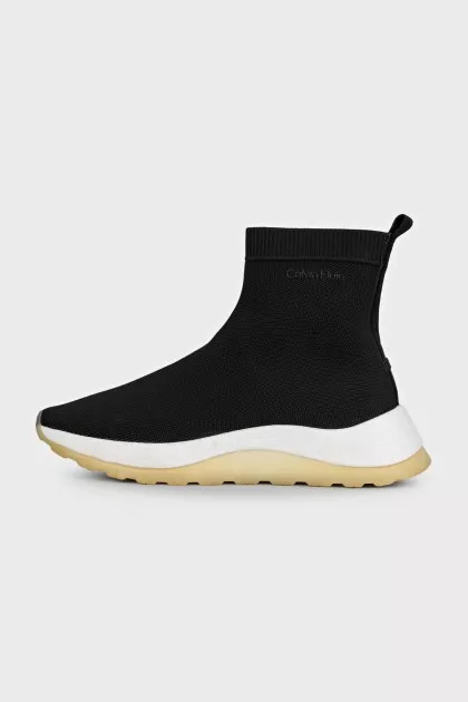 Black textile sneakers with a white sole